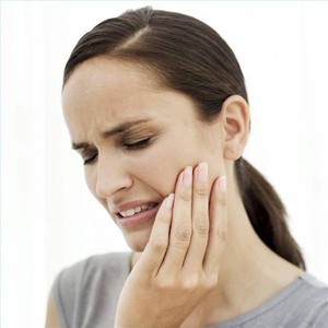 Как унять боль в зубе